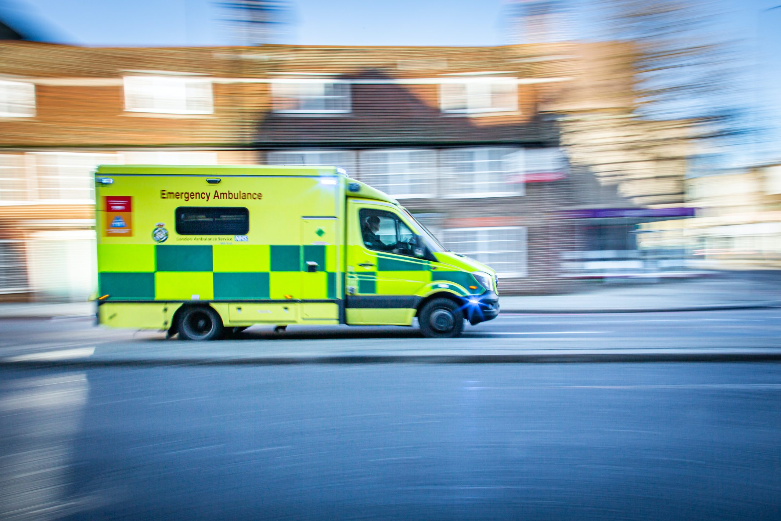 ambulance drives on a london street