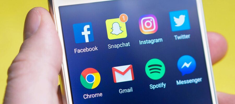 A mobile phone screen with the social media icons visible
