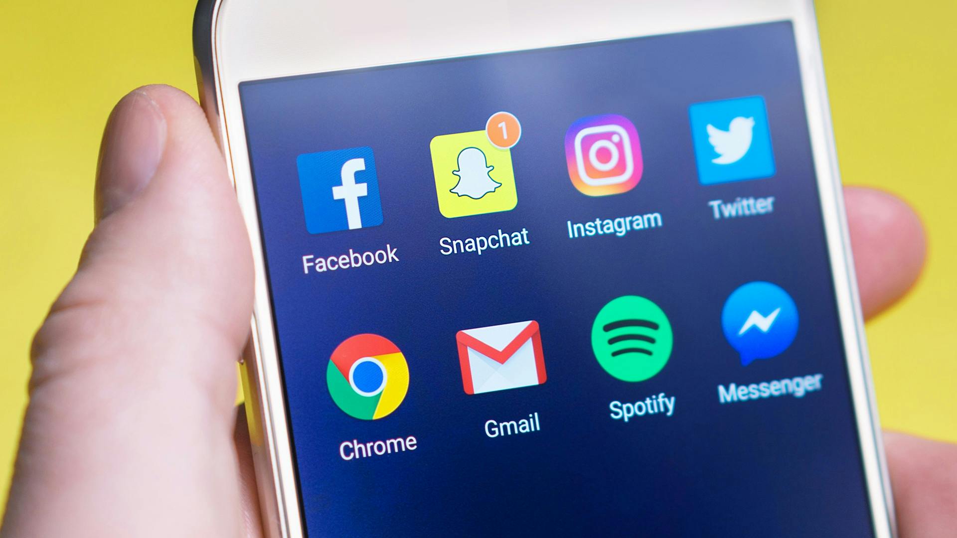 A mobile phone screen with the social media icons visible